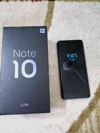 شاومي نوت 10 lite ذاكره 128/6 ملحقات كارتونه وشاحنه مكان بغداد 0771388...