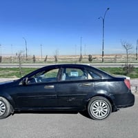 اوبترا  (فورنزا) موديل 2006 رقم بغداد دولي سياره بيه  صبغ بنيد  وبيها ...