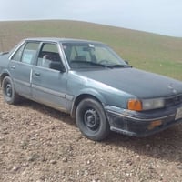 كيا كابتل مديل 1994  للبيع فقط محرك وكير مال مازده  صدر نص عمر رقم نكل...