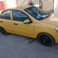 سيارة شيفروليه صفراء، مناسبة للعمل كسيارة أجرة. حالتها الخارجية جيدة م...