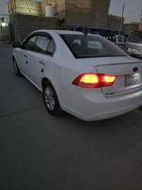 #للبيع اوبتما 2010 كفاله عامة  رقم بغداد  سنوية 28  07840202741