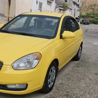 اكسن 2009 رقم انكليزي وارد امريكي بدون ضرر  فقط باب السائق مبدل بأصلي ...