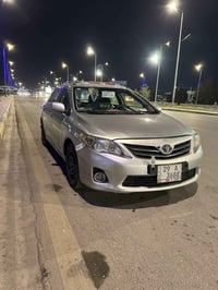 كورله 2009محدثه 2013سياره جاهزه مانقصه برغي تخم تاير حداديه امامي خلفي...