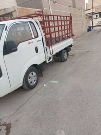كيا حمل موديل 25 رقم واسط بيها صبغ بل ربع صفحت يمنه ول باب سائق مبدل و...
