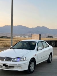 صني ٢٠٠١ • ابيض • جير عادي