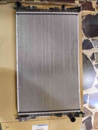 متوفر راديتر فورد تورس اصليه أمريكي بالكارتون من موديل 2010الى2012  07...