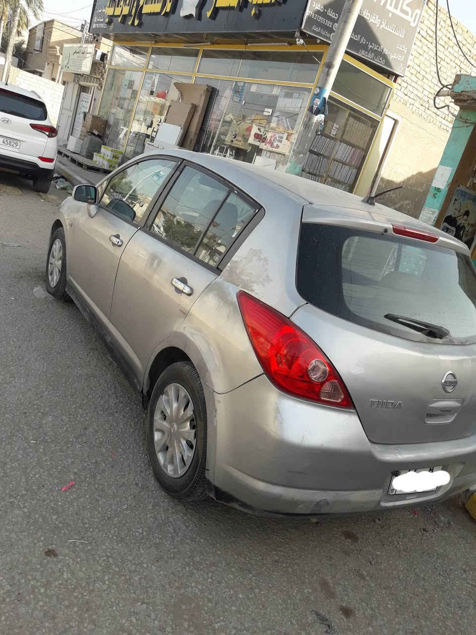 نيسان تيدا 2007 رقم مثنى انكليزي مميز سياره جاهزة من كلشي مكينه كير حداديه تخم تاير كله جديد تدفئه تبريد ثلج جام كهربائي 4 مري كهربائي بيه رشات صبغ بسيطه وبيه جراد قليل السنويه ل 2028 باسمنه  مكان السياره الديوانيه السعر المطلوب 57 وبيه مجال بسيط السياره احلى من الصوره  للاستفسار على الارقام *********** و*********** واني بخدمتكم
