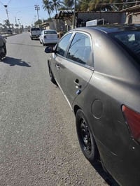 كيا فورتي • ٢٠١٠ • جهة السايق مصبوغة