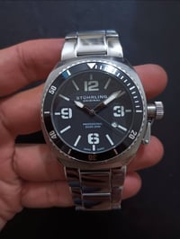 أصلي • كوارتز سويسري • مقاوم للماء ٢٠٠م