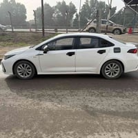 كورلا 2025  شكل الخليجي محرك 1800 هايبرد HEV  داخل جلد اسود رقم بغداد ...