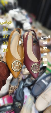 ملابس • تنزيلات • شارع المصرف