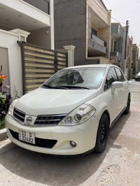 نيسان تيدا 2009 خليجي لون ابيض رقم بغداد انكليزي بسمي بيه 4 قطع ابيع ا...
