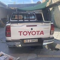 تۆیۆتا هایلۆکس 2023 مەرزیە شەریکەی جیهان  پارجە ڕەش  گیر عادی  لەسەر س...