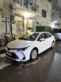 كورلا هايبرد الشكل الخليجي 2025 السياره بغداد مكفوله وماشيه 22الف الها...