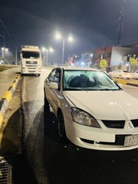 ميتسوبيشي لانسر • ٢٠١١ • ماكينة كبيرة