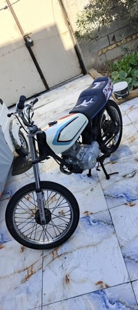 دراجة نارية • قطع جديدة • تانكي جديد