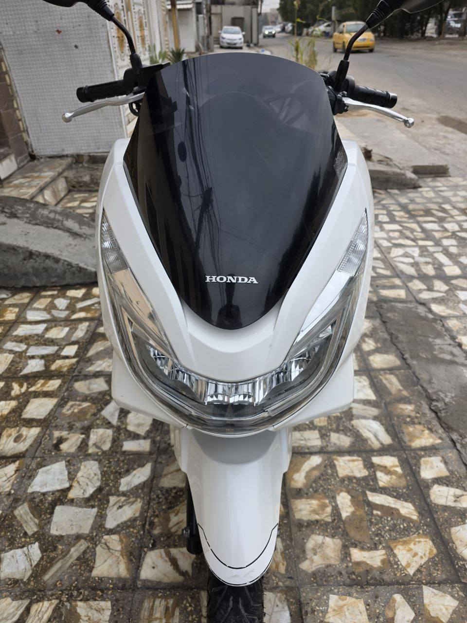 ‏السلام عليكم PCX جيل ثاني 🇯🇵 ياباني
‏مرقم بغداد مشروع وطني رقم إنكليزي تحويل ثاني يوم 

‏الدراجة  بسمي 

‏​⚙️ المحرك: 125 CC

‏​🎨 اللون: أبيض صدفي (لؤلؤي) مـمـيـز ❄️.  

‏ماشية 23 الف وبل يابان ماشية10 تالاف 

‏الدراجة اوياهة سويجات العدد 2

‏مواصفات

‏حساس ازدحام ✅

‏حساس استان ✅

‏الدراجة ورقة المزاد مالتهة وصور اليابان وتقريرهة  مالتهة موجود    

‏ 🛠️ الدراجة: مكفولة كفالة عامة من كلشي 

‏​​📍 الـمـكـان: بـغـداد 🇮🇶

‏📱 لـلـتـواصـل والإسـتـفـسـار:📞 [ *********** ]

‏
