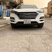 هونداي توسان خليجي موديل ٢٠٢١  رقم بغداد الماني بسمي  لون ابيض  ٤ سلند...