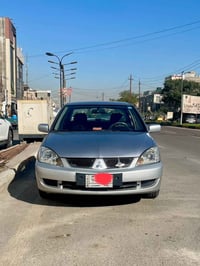 للبيع لانسر موديل 2006 محرك 1500 قبق اسود  محرك وكير خير من الله   مصب...