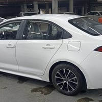 تيوتا كورلا هايبرد 2024 كفاله عامه رقم بغداد تحويل مباشر  ماشيه 18 حجم...