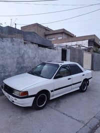 مازدا ٣٢٣ • كاربراتير • كويسينجاك