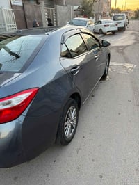 للبيع كورلا فول واحد ع واحد موديل 2014 حادثها باب خلفي وشوية من الجامل...