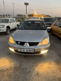 لانسر 2009 للبيع محرك 1.5 محرك كير تبريد تخم تاير خير من الله سنويه بس...