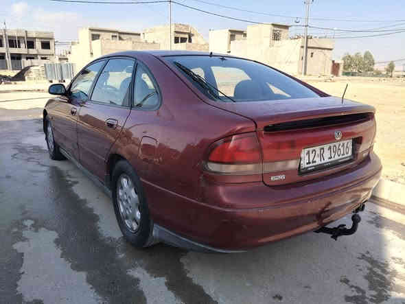 مازدا فاصوليا للبيع محرك 6 سلندر بدون صبغ تبريد شغال كابون بانزين كير و محرك شرط موديل 93    50 وبيها مجال
