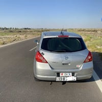 نيسان تيدا ٢٠٠٧ للبيع رقم بغداد هزه جديده باسمي السياره بدون ضربه بيهة...