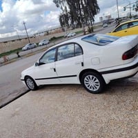 كوريلا موديل 1994 كير توماتيك ومحرك شرط فحص  بيها قطعه وحده صبغ  السعر...