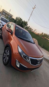 سبورتج ٢٠١٣ خليجي رقم بغداد أنكليزي بأسمي بدون فتحة سقف لون مشمشي نانو...