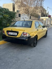 لانسر ٢٠١٠ • رقم إنكليزي • شاشة جديدة