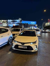 كورلا هايبرد 2025 مكفوله من كلشي ماشيه 28 الف رقم بغداد تحويل ثاني يوم...