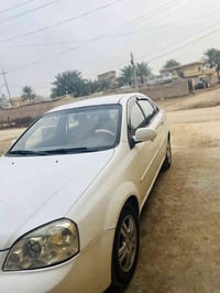 أوبترا ١١مكفوله كفاله عامه سونار بينه  السياره بسمي رقم بغداد. محرك كي...