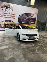 جارجر موديل 2018 رقم اربيل باسمي وارد خليجي مكفولة من الحادث  لون ابيض...