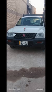 مسيوبوشي ٢٠٠٥ السياره بلادي بيه بارد بل بدي كلش بسيط رقم بغداد بسمي مك...