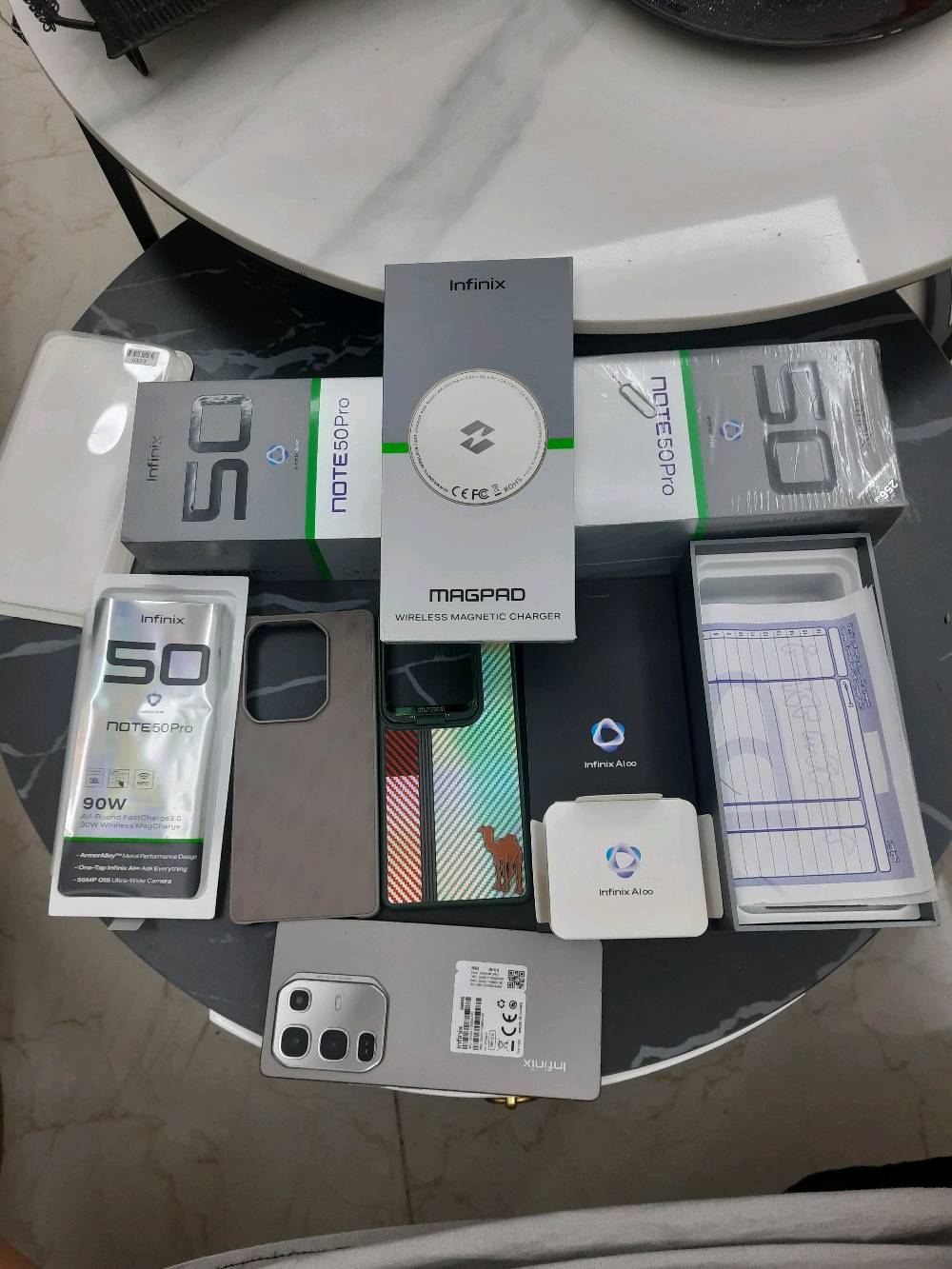 انفنكس نوت 50 برو مع كافه ملحقاته مع كفر زياده  شاحن لاسلكي ذاكره 256 رام 12×12 البطاريه جيده جدا شحن سريع خلال 15 دقيقه فوول