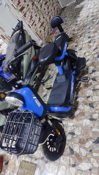 دراجة كهربائية • سكوتر