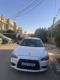 لانسر قرش 2015 رقم بغداد باسمي تحويل ثاني يوم السعر 72  وبيها مجال رقم...