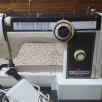 مكينه خيطه • شغاله • سنغافورة