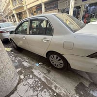 لانسر الشركة العامة ٢٠١١ باسمي مشروع وطني رقم بغداد سيارة بلادية تخم ت...