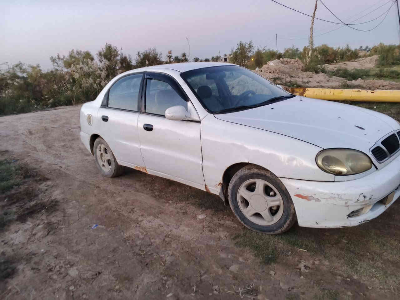 السلام عليكم للبيع دايو لانوس 
موديل 1998 سنويه لنهايه 2027   مكينه  1600 كير عادي مكينه وكير مكفولات شرط  لاتنقيص ولاتبخير  تايرات صار شهر من شديتهن كهربائية كلها شغاله رقم بغداد رقم مميز.     . شاشه لمس  كامره خلفيه تشتغل ويه البك 
سعر 28  نقص مشط استيرن فقط. تريد تحويل تريد وكاله 
للاستفسار *********** مكانها واسط الزبيديه
