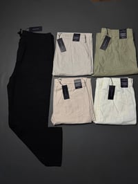 لارج • خصر ٣٤-٣٦ • تومي