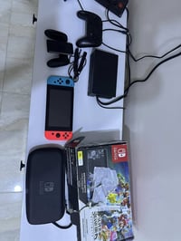 نيتندو سويتج مهكر كامل ملحقات مع كارتون وحافضه وجوستك اضافي  للبيع مكا...