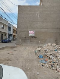 قطعة أرض  ركن.  زراعي المساحة  100م   10 *  10 مقابيل محكمة الدورة شار...