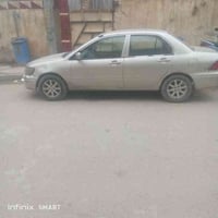 لانسر2003 محرك 1300اوتو رقم بغداد انكليزي باسمي تبريد صبغ عام  بغداد ا...