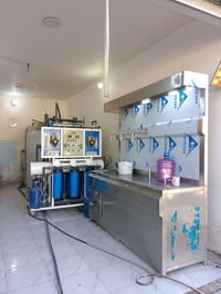 شركة أرض الخوالي لمعالجة المياة إنتاج ميز تعبية  المياة مع غسالة الدبا...