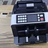 عداد نقود • يحسب دينار ودولار • كشف مزور