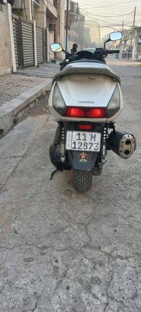 شباب دراجه سلفر مكينه 400 مرقم بغداد مكفوله عام نكره بكل وقت 077158090...