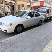 صني ٢٠٠٤ • ابيض • كير اوتو